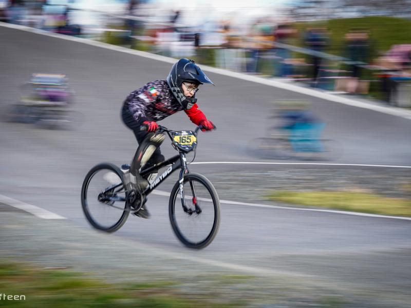 Boy moving fast on BMX bike