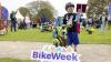 young child holding bike