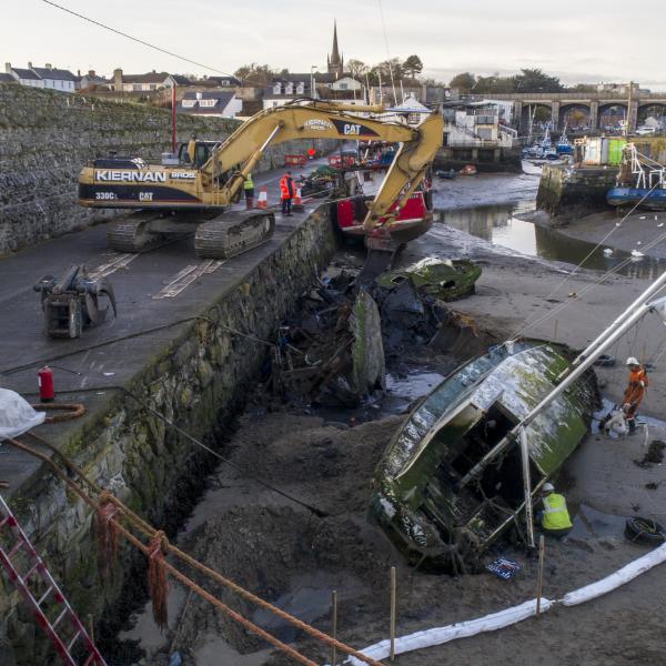 Wrecks from Balbriggan Harbour being lifted from the water.