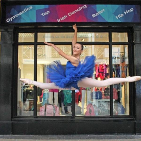 image of a girl dancing outside the Dance Emporium
