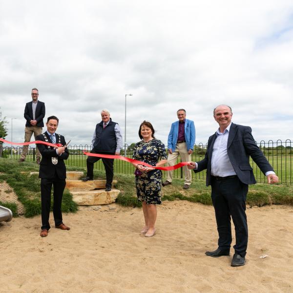 Deputy Mayor of Fingal, Cllr Robert O'Donoghue cuts the ribbon to officially open the Play Trail at Rathmore Park, Lusk