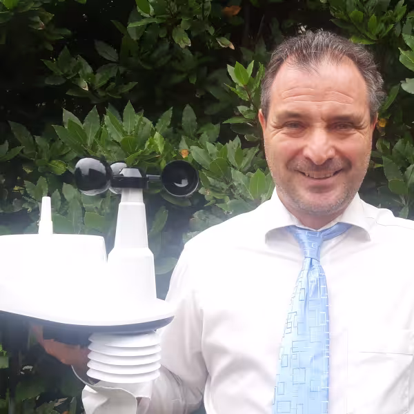 Kevin Vallely holding weather station