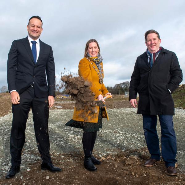 Mayor, Tainaiste and Minister for Housing on site turning first sod with spade