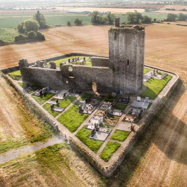 Aerial phoot stone church and graveyard