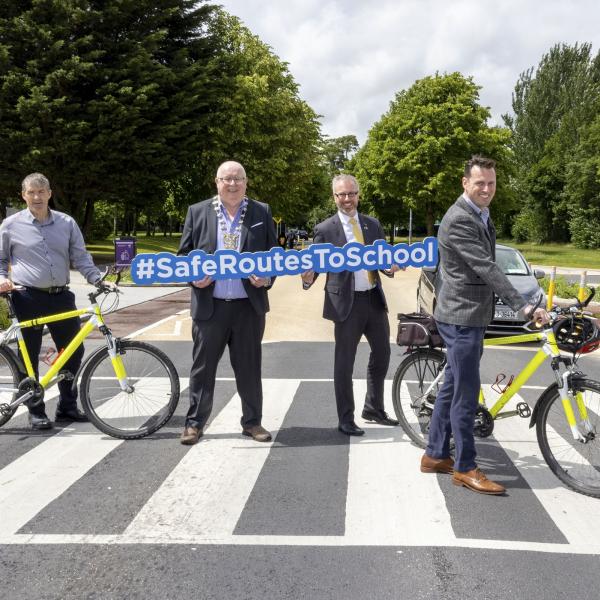 Mayor, Minister for Children and Active Travel staff on zebra crossing