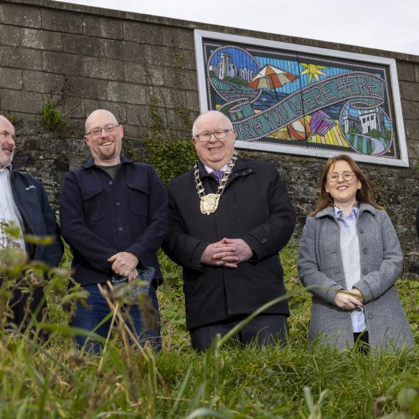 Wish you were here image with Irish Rail Technical Executive Enda Murtagh, Artist Dave West, Mayor of Fingal Mayor Cllr Howard Mahony, Cllr Karen Power and Irish Rail Supervisor Larry Flood