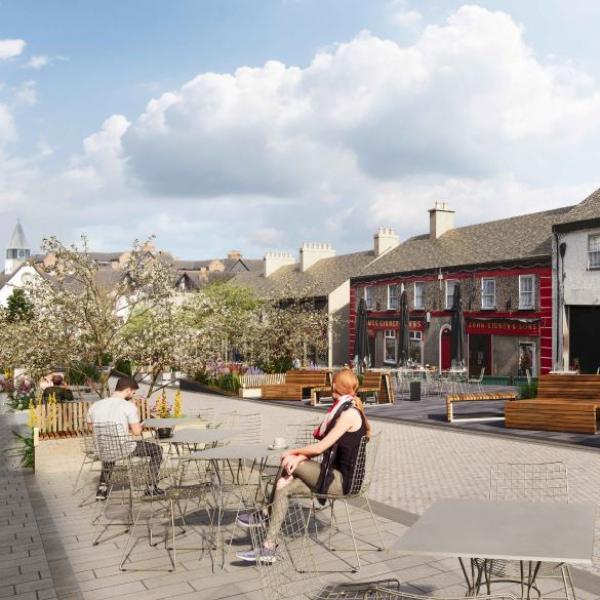 pedestrian street with cafe tables and planting