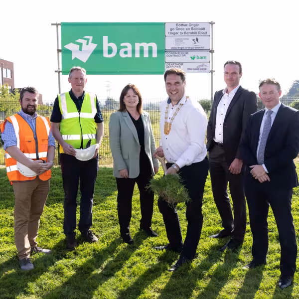 Man turning sod of earth on spade