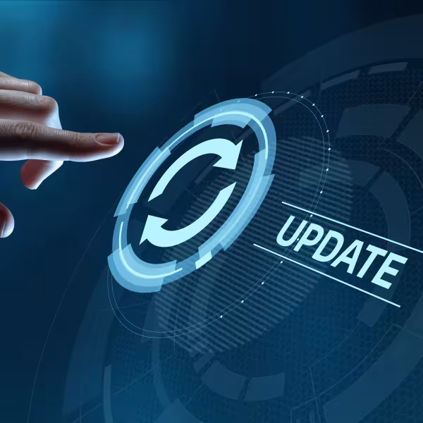 Hand touching word update on a glass panel