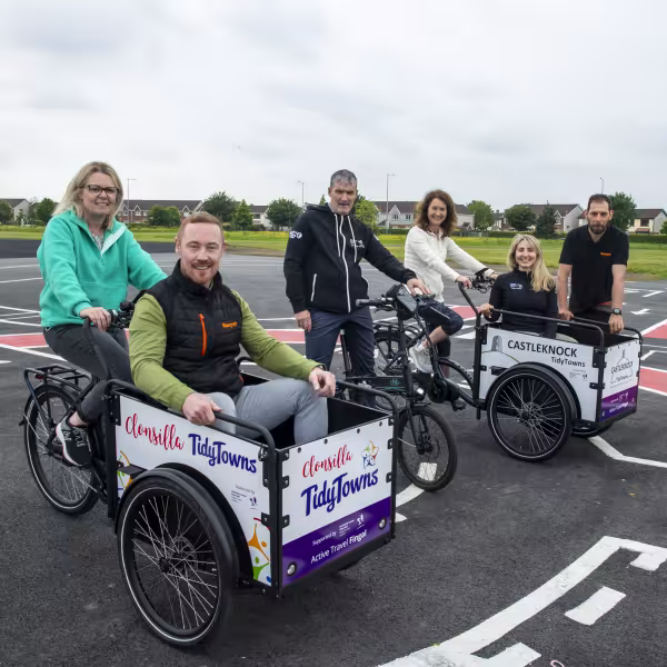 People sitting in cargo bikes