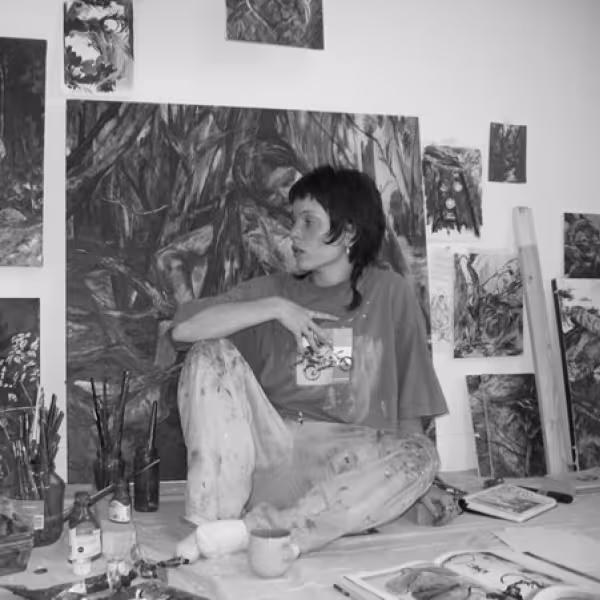 Nicole Manning surrounded by her work