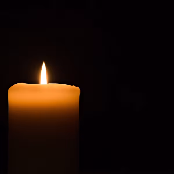 Candle on dark background
