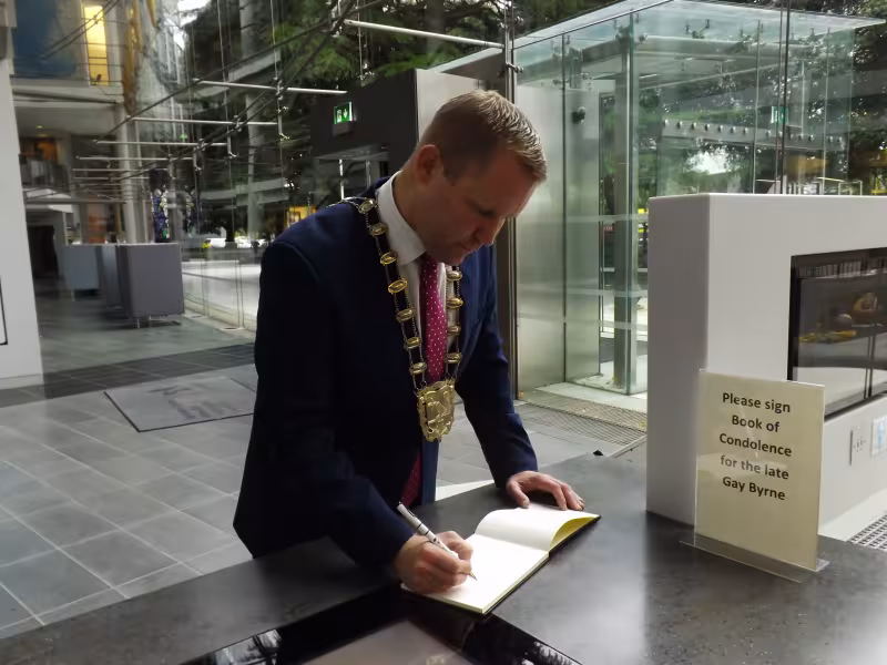 Mayor Signing Book of Condolence for Gay Byrne in Swords