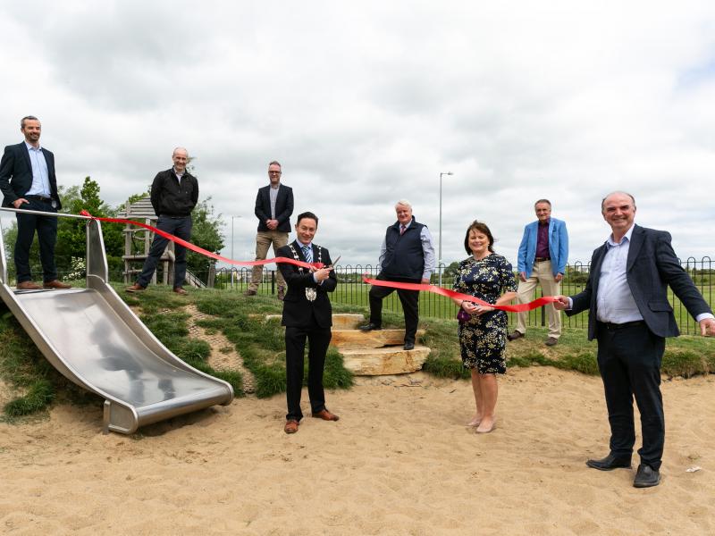 Deputy Mayor of Fingal, Cllr Robert O'Donoghue cuts the ribbon to officially open the Play Trail at Rathmore Park, Lusk