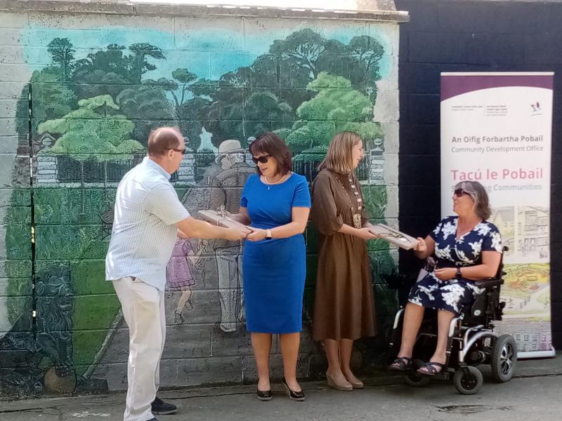 Chief Executive and Guests at the Rush Mural class=