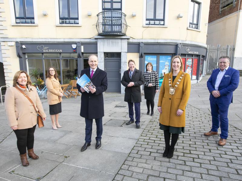 Taoiseach Micheál Martin TD was presented with a copy of the Our Balbriggan Regeneration Plan by Mayor of Fingal Cllr Seána Ó Rodaigh outside the Our Balbriggan Hub in St George’s Square. Also in the photo are (from left): Cllr Grainne Maguire; Emer O’Gorman, Director of Economic Enterprise Tourism and Cultural Development at Fingal County Council; Minister for Housing, Local Government and Heritage, Darragh O’Brien TD; AnnMarie Farrelly, Chief Executive, Fingal County Council and Cllr Tony Murphy.