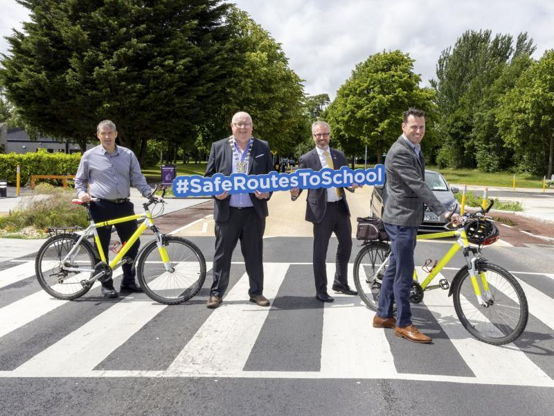 Mayor, Minister for Children and Active Travel staff on zebra crossing