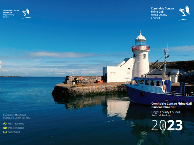 Picture of the front and back cover fo the 2023 Budget Book which features a photograph of Balbriggan Harbour and Lighthouse