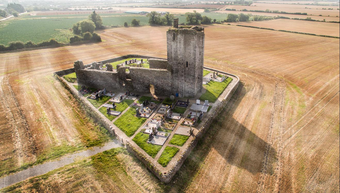 Aerial phoot stone church and graveyard