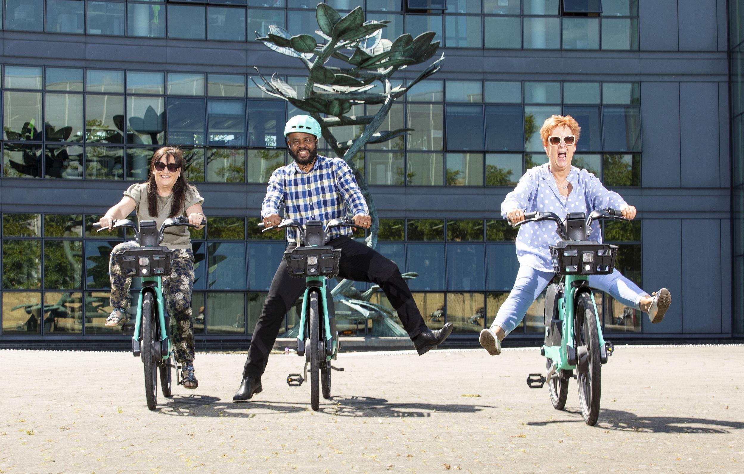 3 people cycling bikes 