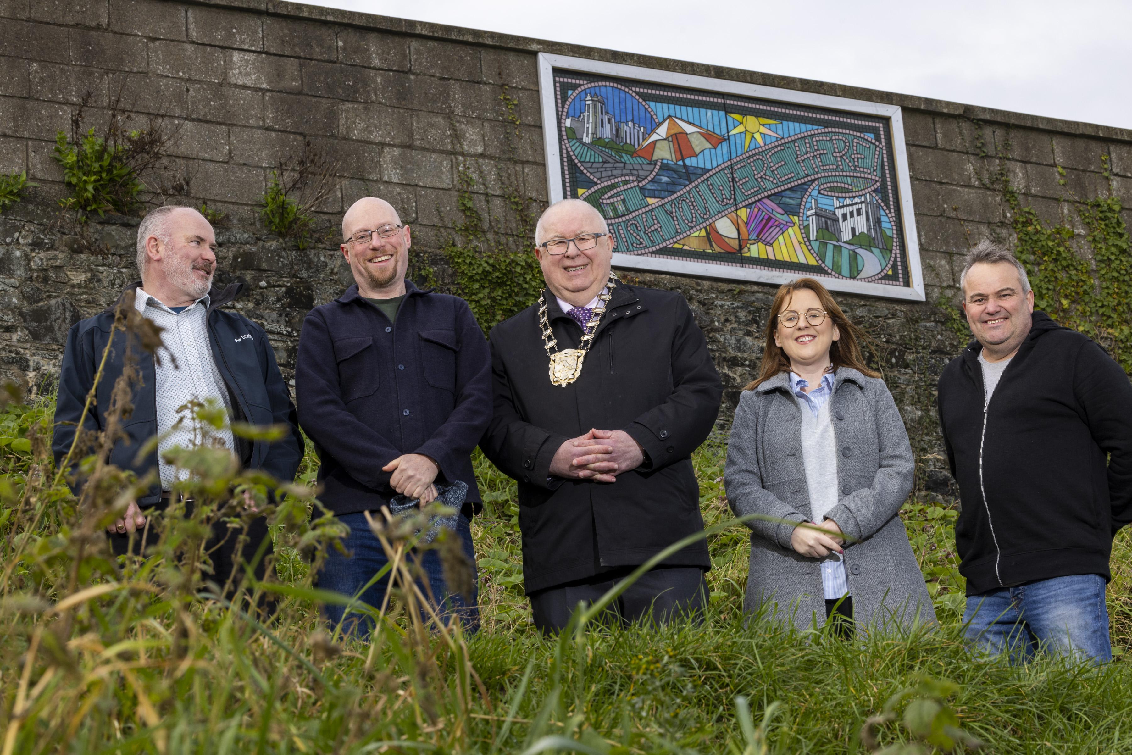 Wish you were here image with Irish Rail Technical Executive Enda Murtagh, Artist Dave West, Mayor of Fingal Mayor Cllr Howard Mahony, Cllr Karen Power and Irish Rail Supervisor Larry Flood