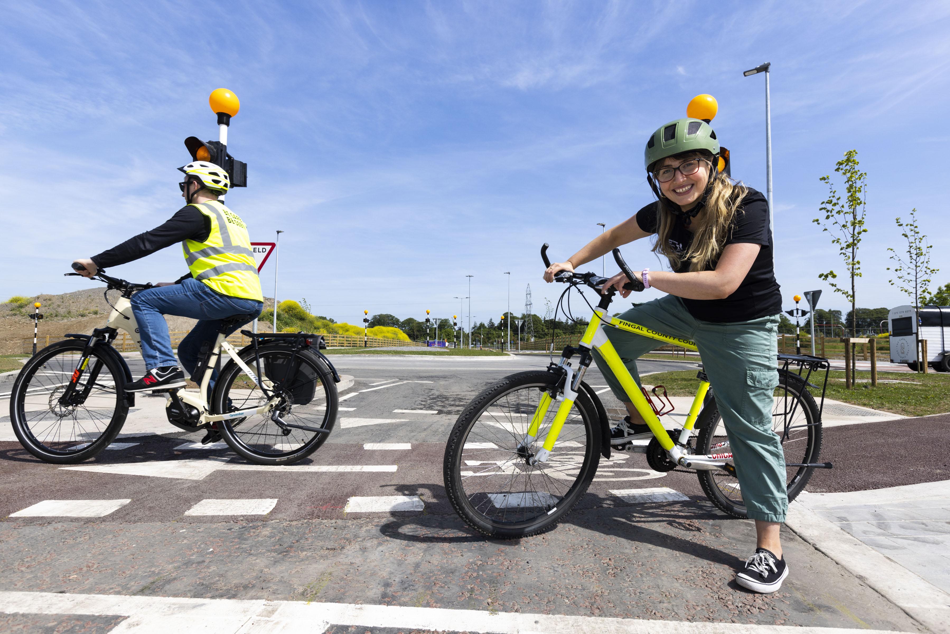 Cyclists trying out Irelands first cycle friendly roundabout
