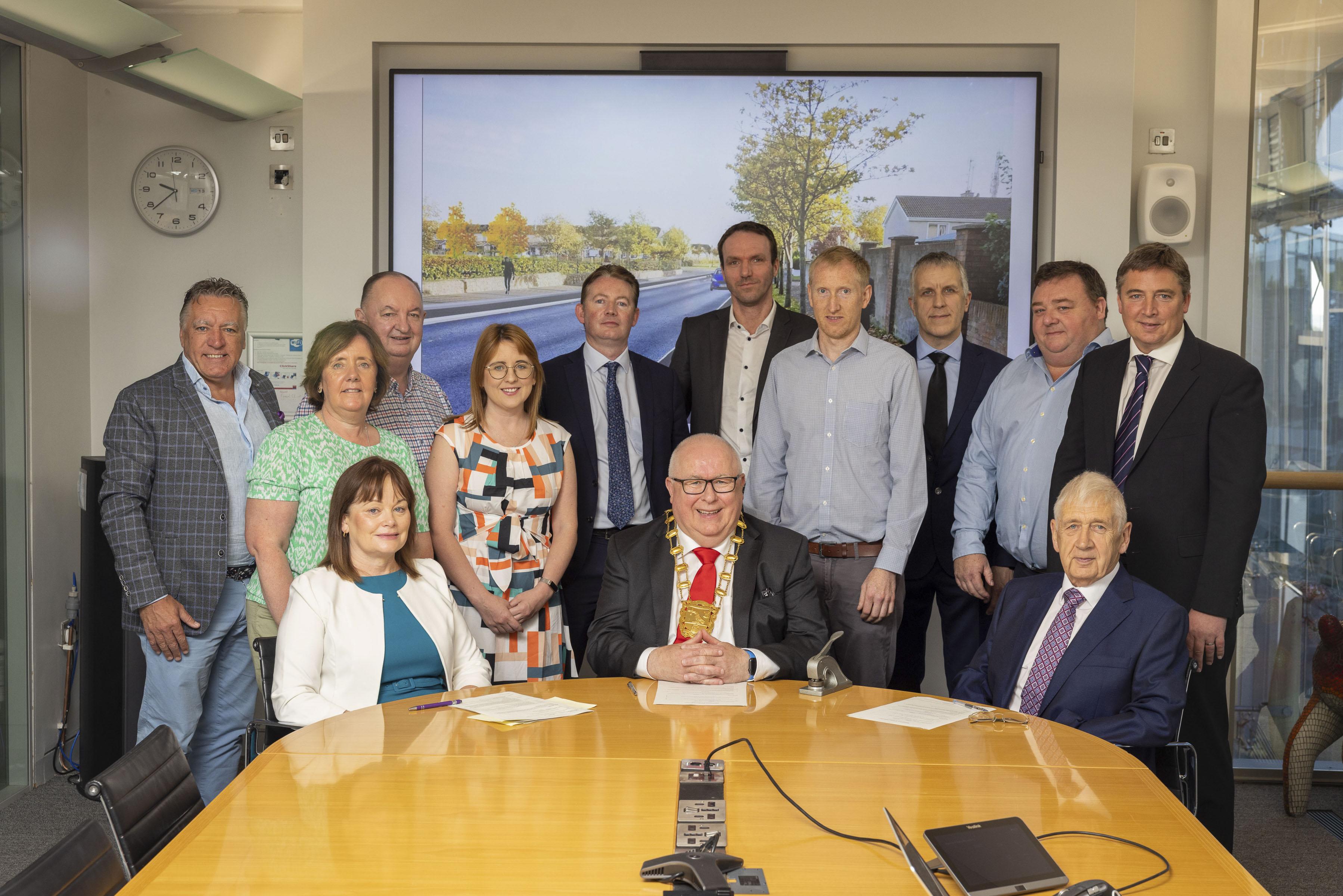 Group of people gathered at conference table