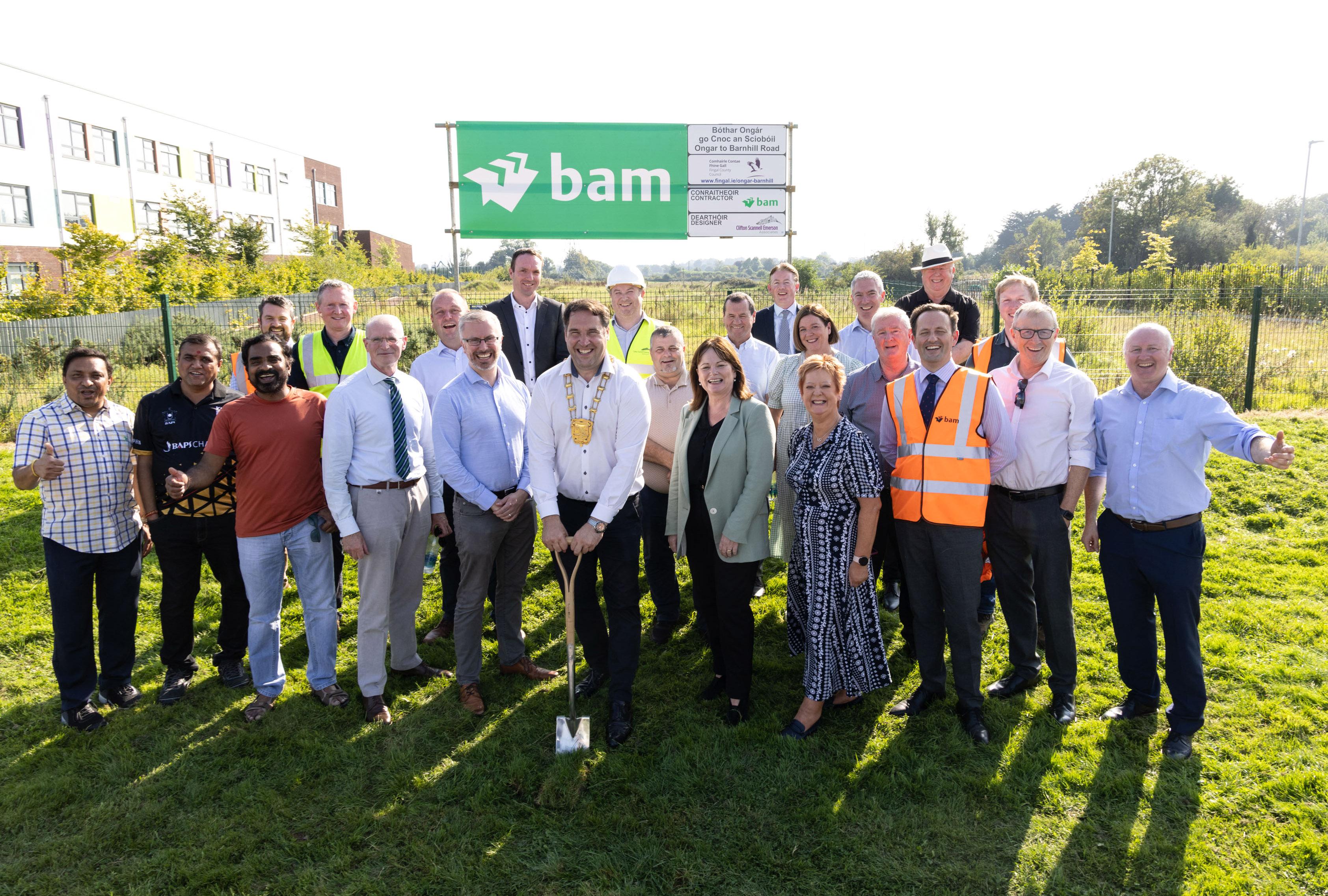 Mayor turns sod surrounded by councillors, staff and elected representatives