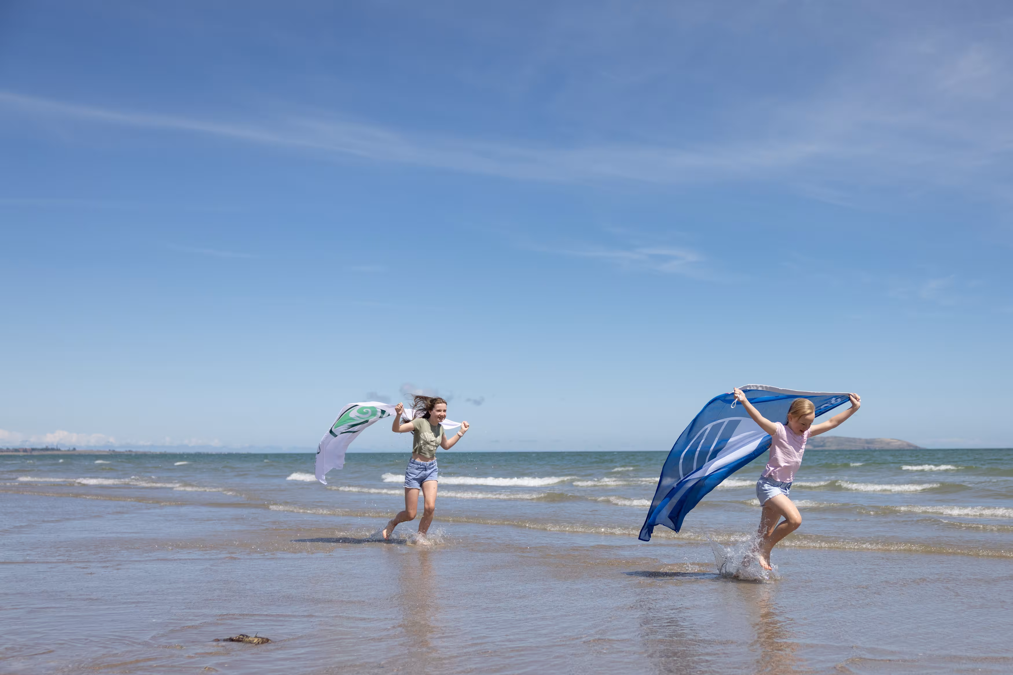 Balcarrick Beach in Donabate is one of the few beaches in Ireland to receive a Blue Flag and a Green Coast Award. Alannah and Farrah celebrate the award of 70 Green Coast Awards and 99 Blue Flags for the 2025 season. (Photo by Naoise Culhane)