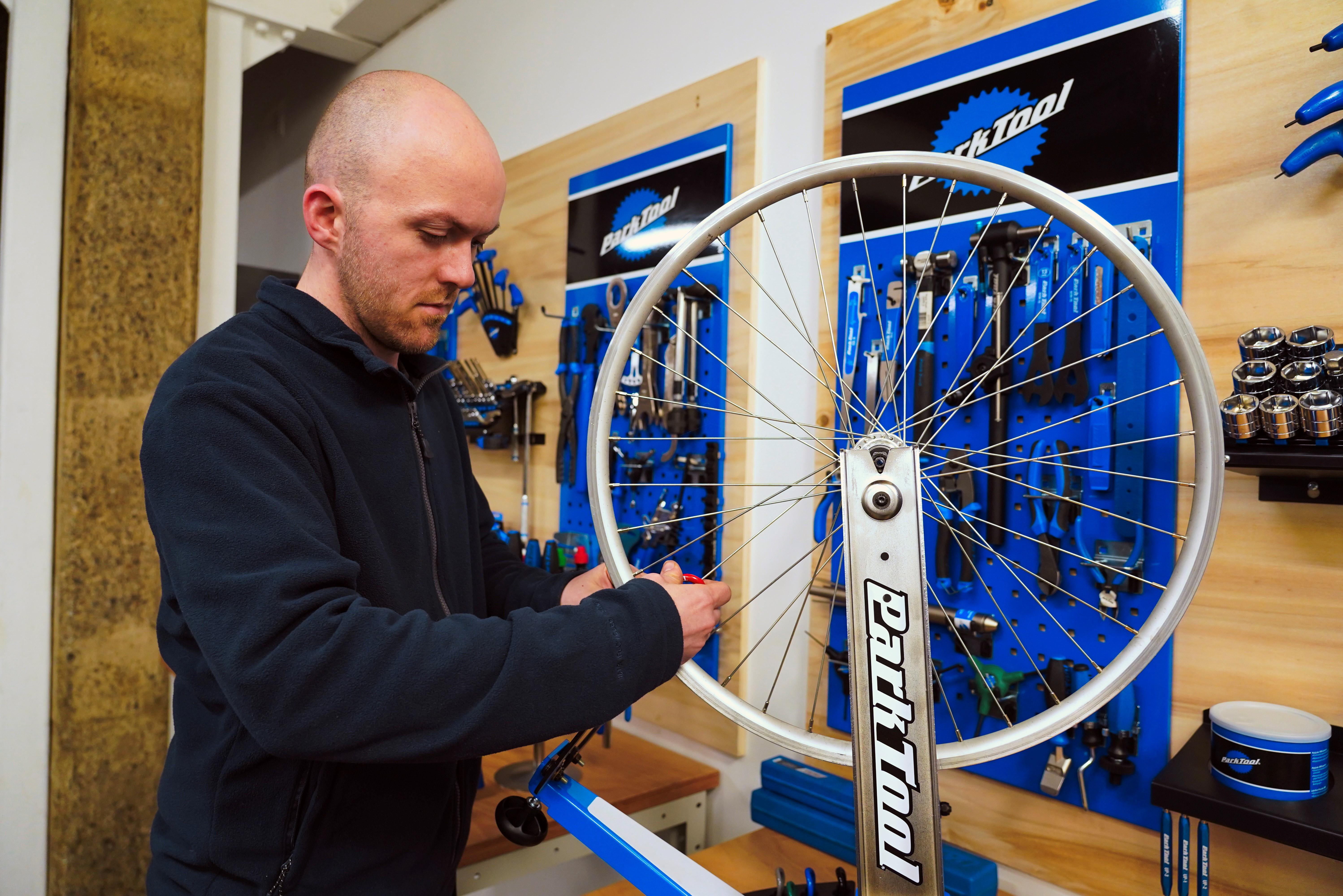 Team member from Rediscovery Centre Ballymun working on a bike
