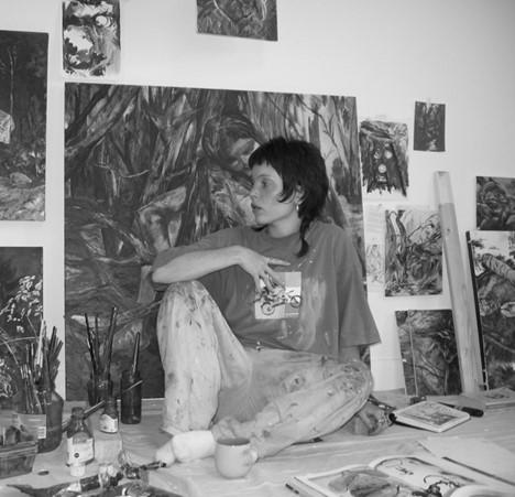 Nicole Manning surrounded by her work